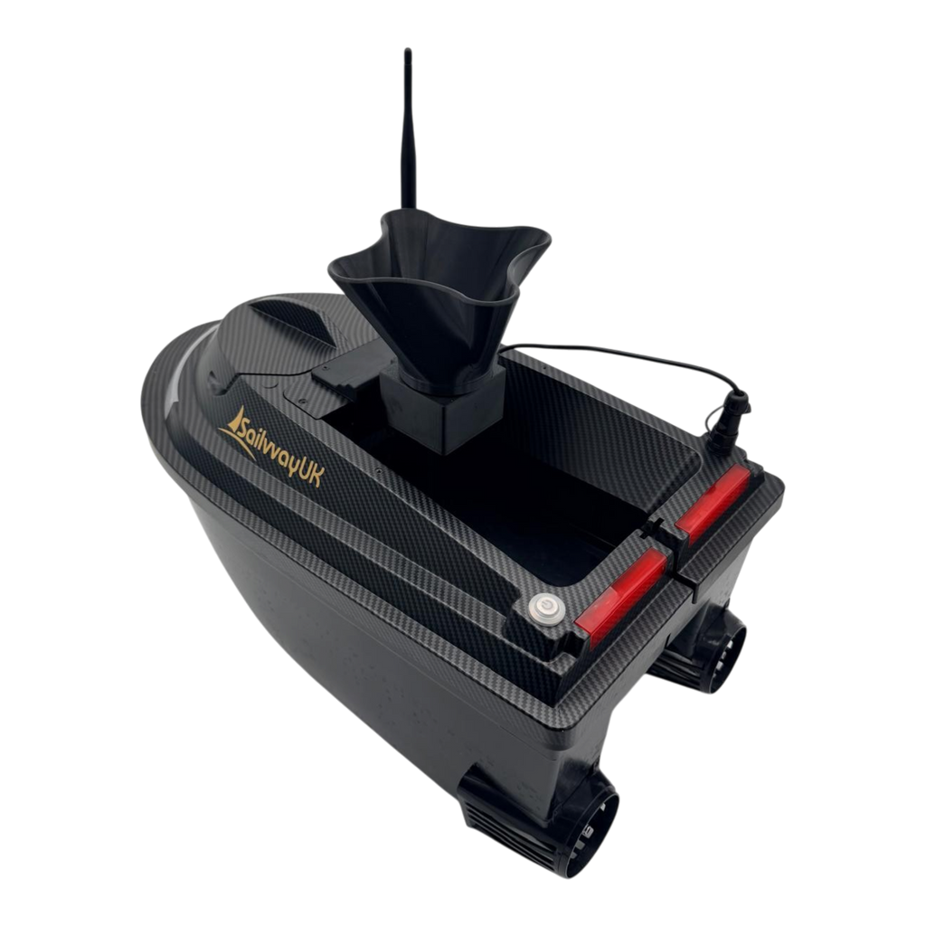 Sailvvay UK X-Series bait boat with black carbon fiber finish and mounted bait spreader accessory in a studio setting